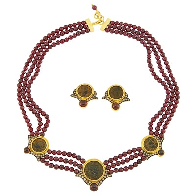 Lot 2175 - Gold, Garnet Bead, Cabochon Garnet, Bronze Coin and Diamond Necklace