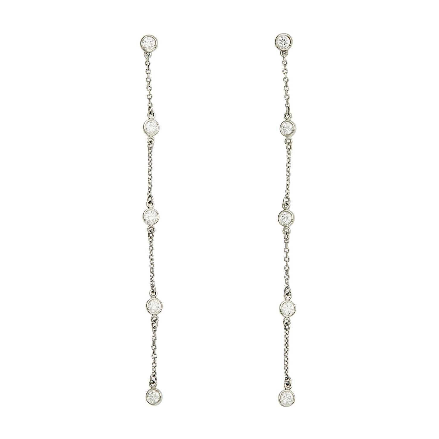 Lot 1257 - Tiffany & Co., Elsa Peretti Pair of Platinum and Diamond 'Diamonds by the Yard' Pendant-Earrings