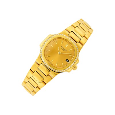 Lot 30 - Patek Philippe Gold and Diamond 'Nautilus' Wristwatch, Ref. 4700/2