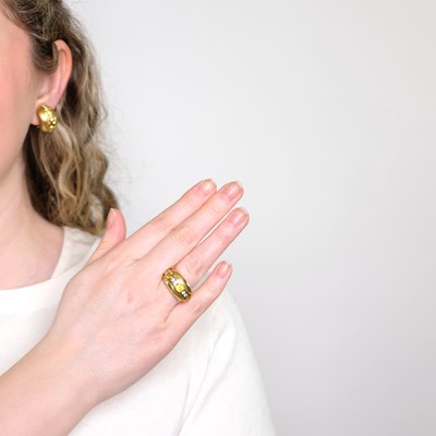Lot 1138 - Barry Kieselstein-Cord Pair of Gold, Yellow Sapphire and Diamond Half-Hoop Earclips and Bombé Ring