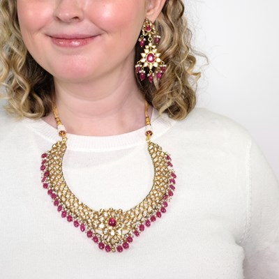 Lot 1099 - Indian Gold, Jaipur Enamel, Foil-Backed Ruby and Diamond, Ruby and Red Glass Bead and Freshwater Pearl Pendant-Necklace and Pair of Pendant-Earrings