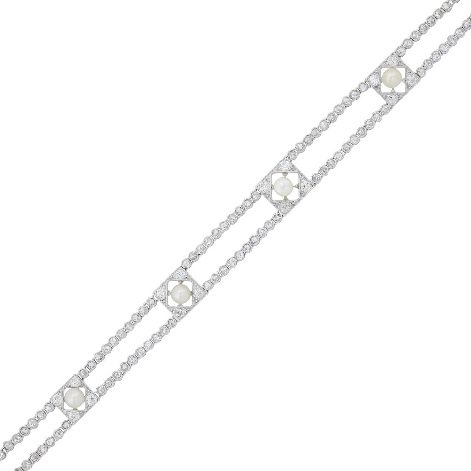 Lot 1183 - Belle Epoque Double Strand Platinum, Button Pearl and Diamond Bracelet