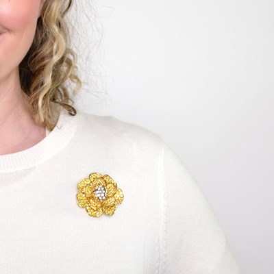 Lot 1143 - Gold, Yellow Sapphire and Diamond Flower Clip-Brooch