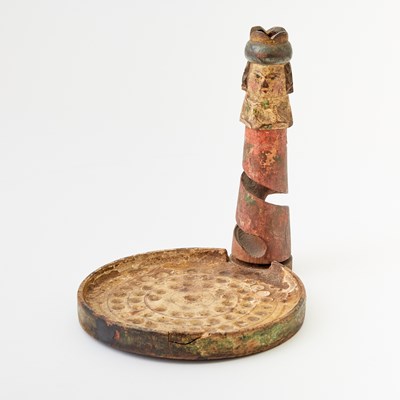 Lot 375 - A whimsical carved and painted wood game of chance in the form of a chess king