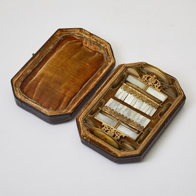 Lot 359 - A wealthy gambler's cased set of mother-of-pearl tokens and counters
