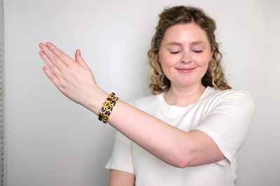 Lot 1140 - Pair of Gold, Cabochon Gem-Set and Diamond Bracelets