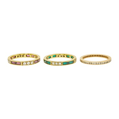 Lot 2214 - Three Gold, Ruby, Emerald and Diamond Band Rings