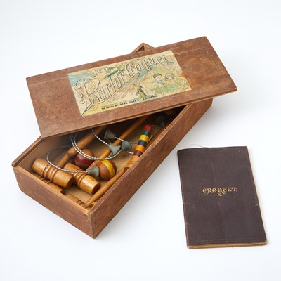 Lot 410 - A table croquet set and an early book on the game
