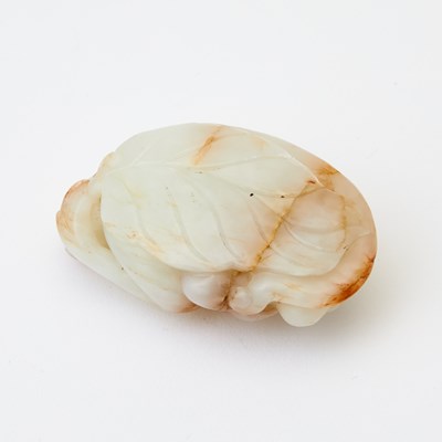 Lot 61 - A Chinese White Jade Carving of a Monkey
