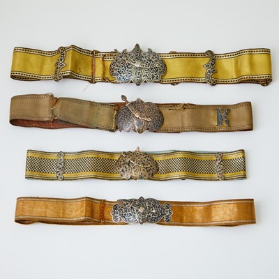 Lot 639 - Group of Four Russian Silver and Niello Belt Buckles with Fabric Belts