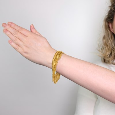 Lot 1116 - Gold Fringe Bracelet and Fringe Section