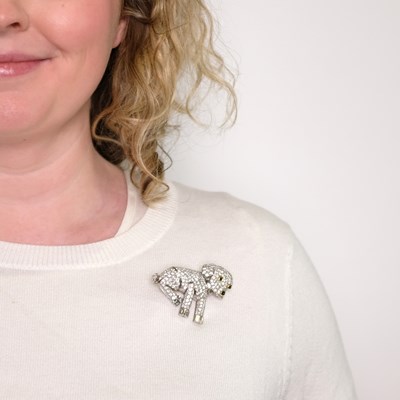 Lot 1173 - Platinum, Gold, Diamond and Black Onyx Dog Brooch