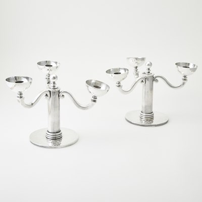Lot 748 - Pair of Jean Despres Silver Plated Three-Light Candelabra