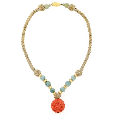 Lot 2083 - Gold, Carved Coral and Jade Beads, Diamond and Cord Pendant-Necklace