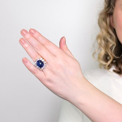 Lot 1126 - Two-Color Gold, Cabochon Sapphire and Diamond Ring