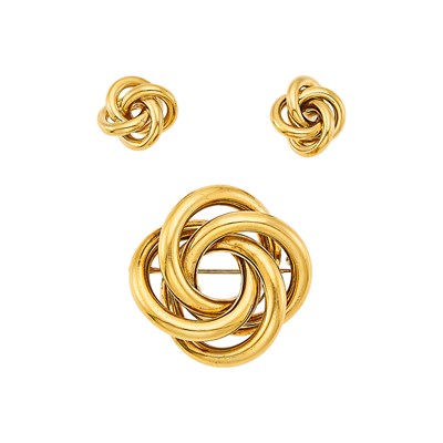 Lot 1021 - Tiffany & Co. Gold Swirl Pin and Pair of Earrings