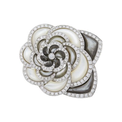 Lot 1063 - White Gold, Gray and White Mother-of-Pearl and Diamond Flower Clip-Brooch