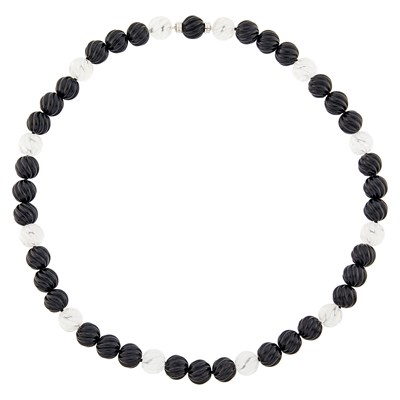 Lot 1262 - Carved Rock Crystal and Black Onyx Bead Necklace with White Gold Clasp