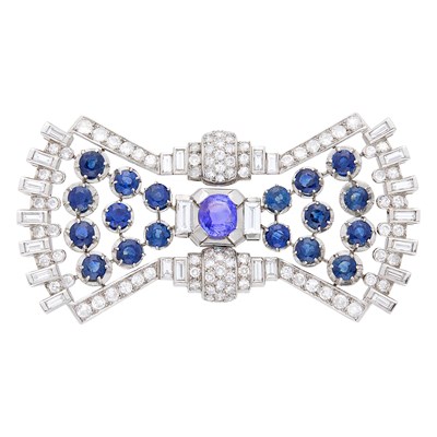 Lot 114 - Platinum, White Gold, Violet Sapphire, Sapphire and Diamond Bow Brooch, France