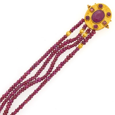 Lot 1200 - Four Strand Ruby Bead, Gold and Ruby Bracelet