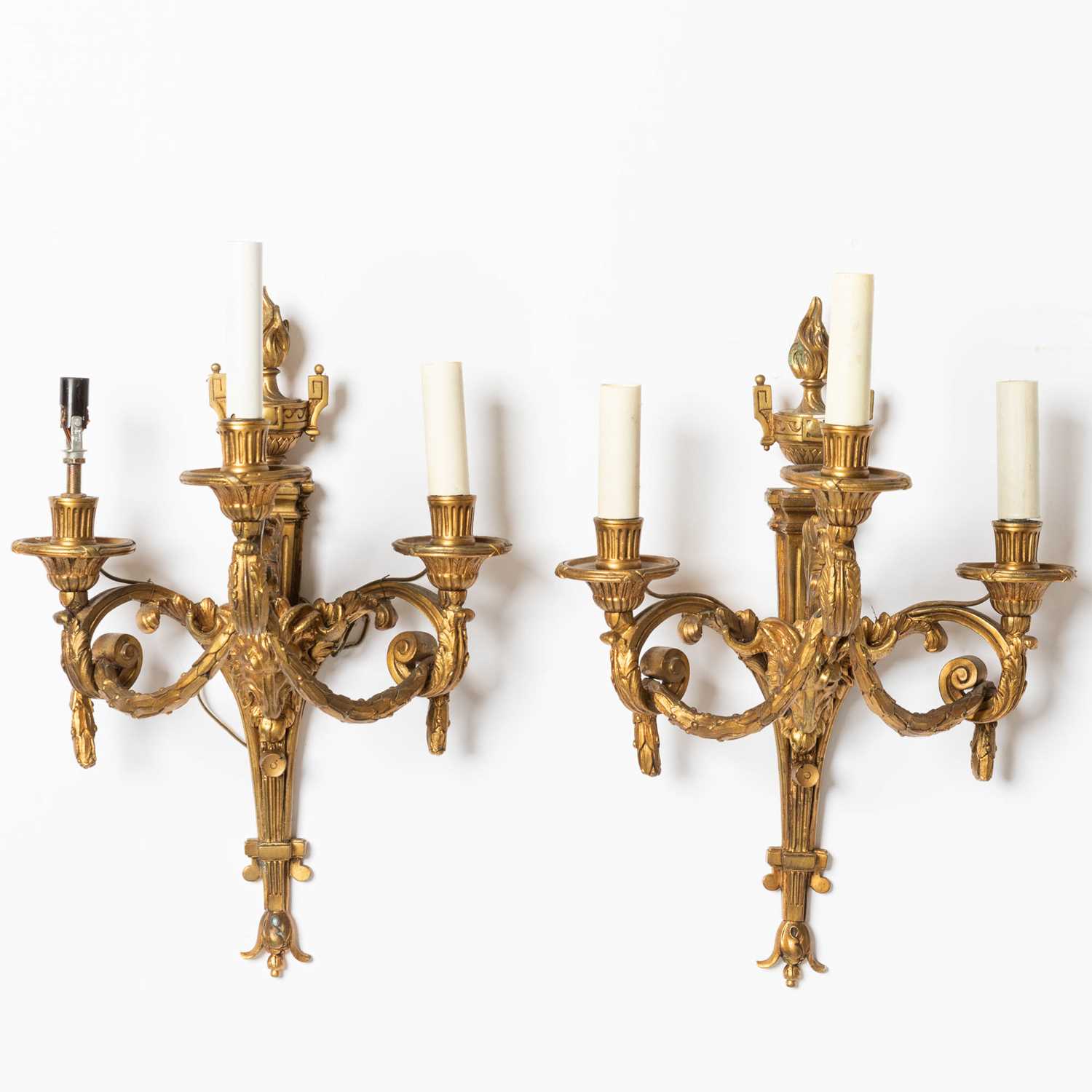 Lot 243 - Pair of Louis XVI Style Three-Light Gilt-Metal Sconces with Ram's Heads