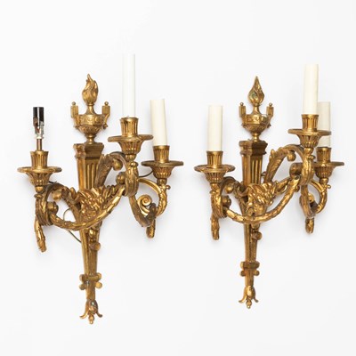 Lot 243 - Pair of Louis XVI Style Three-Light Gilt-Metal Sconces with Ram's Heads