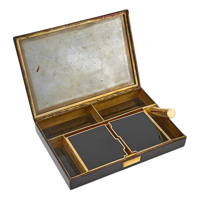 Lot 1279 - Cartier Silver-Gilt and Black Enamel Vanity, France