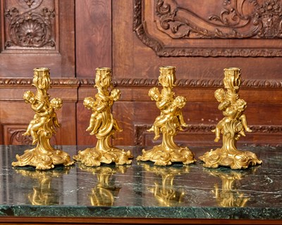 Lot 91 - Four Louis XV Style Gilt-Bronze Figural Candlesticks