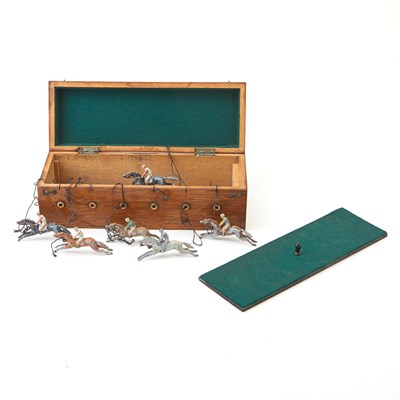 Lot 421 - A cased tabletop croquet set and two horse racing games