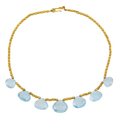 Lot 1171 - Attributed to Julie Baker Gold Bead and Blue Topaz Necklace