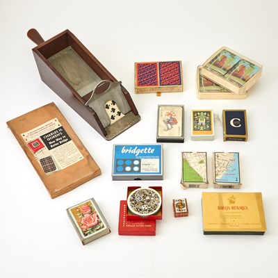 Lot 432 - A group of card decks and card dealing banker machine