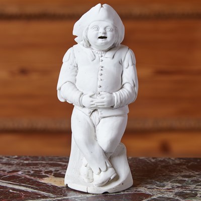 Lot 497 - FRENCH BISCUIT PORCELAIN FIGURE OF A LAUGHING MAN