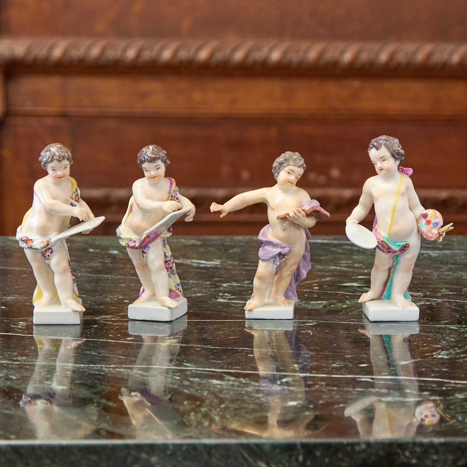 Lot 409 - Four Meissen Porcelain Figures of Putti Emblematic of the Arts and Sciences