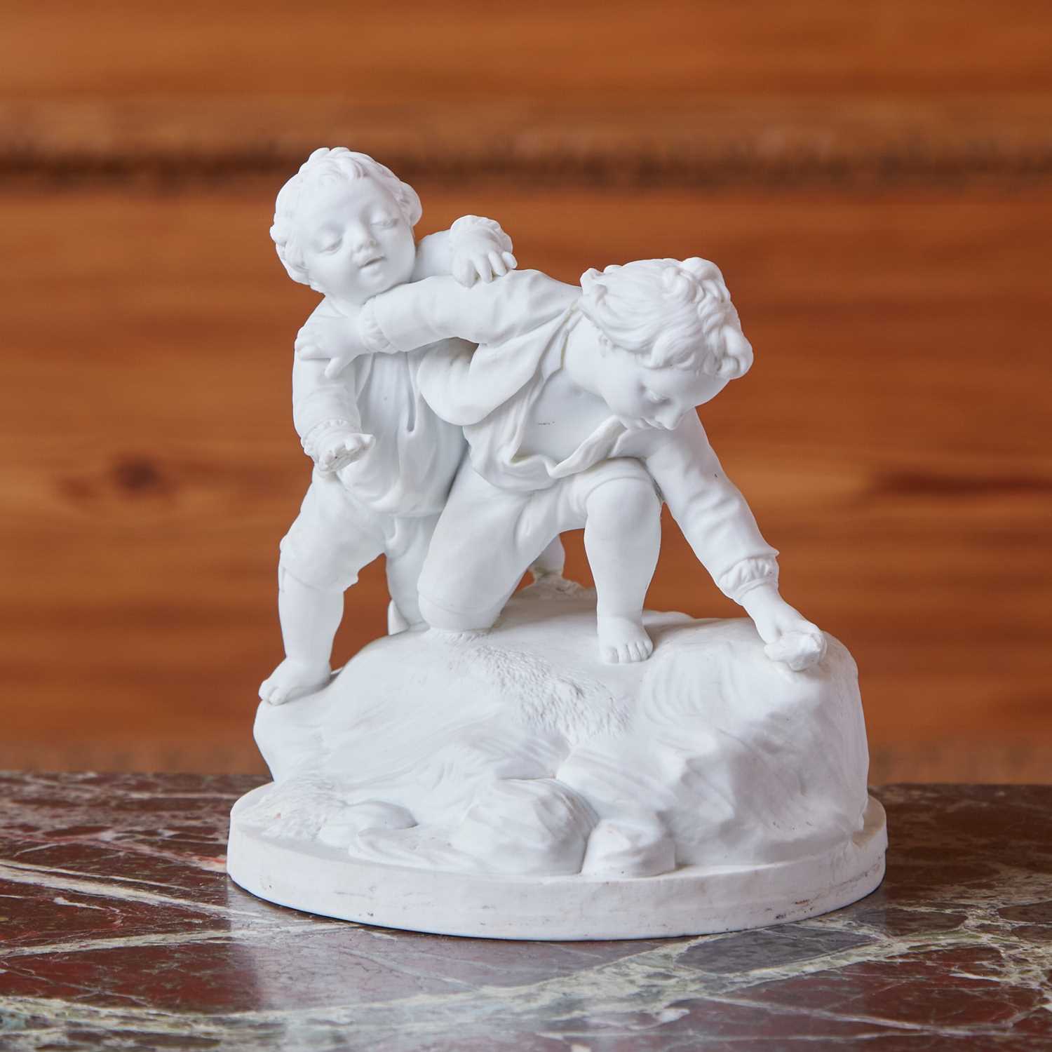 Lot 422 - Luneville Biscuit Figure Group of Two Boys at Play