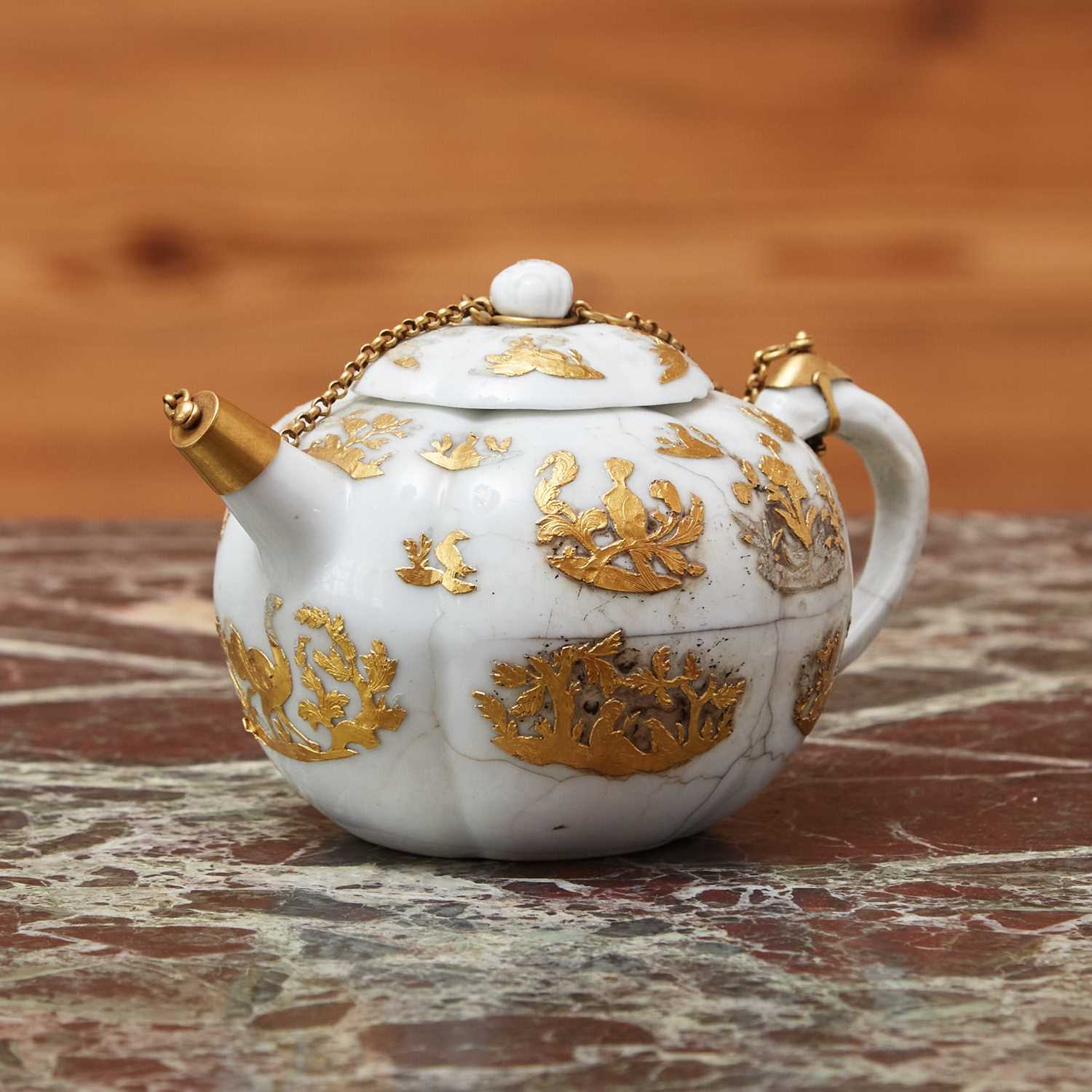 Lot 408 - SILVER-GILT MOUNTED CHINESE PORCELAIN SMALL LOBED TEAPOT AND COVER WITH APPLIQUE GOLD DECORATION