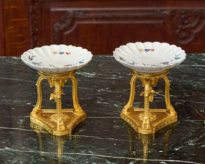 Lot 429 - PAIR OF LOUIS XVI PERIOD GILT-BRONZE TREFOIL STANDS MOUNTED WITH CHANTILLY PORCELAIN FLUTED DISHES