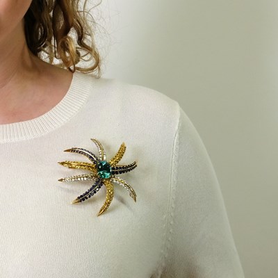 Lot 84 - Tiffany & Co. Two-Color Gold, Blue-Green Tourmaline, Sapphire, Yellow Sapphire and Diamond 'Fireworks' Brooch