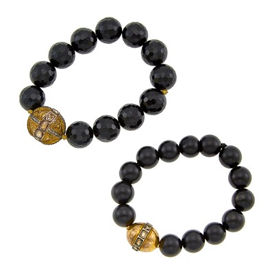 Lot 1147 - Pair of Silver-Gilt, Gold, Foil-Backed Diamond and Black Onyx Bead Bracelets