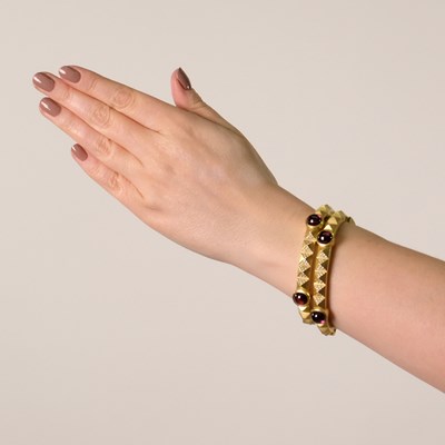 Lot 159 - Barry Kieselstein-Cord Pair of Gold, Cabochon Rubellite and Diamond Bangle Bracelets