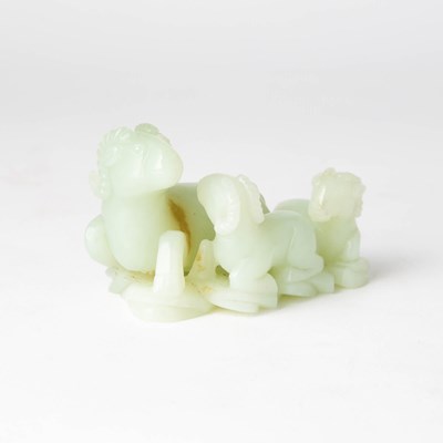 Lot 422 - A Chinese Celadon Jade Figural Carving