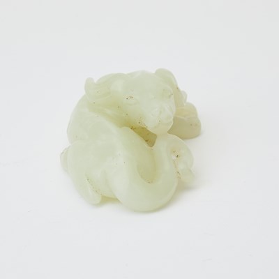 Lot 28 - A Chinese Celadon Light Jade Carving of a Hound