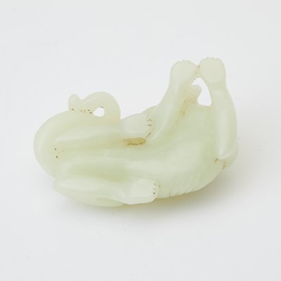 Lot 28 - A Chinese Celadon Light Jade Carving of a Hound