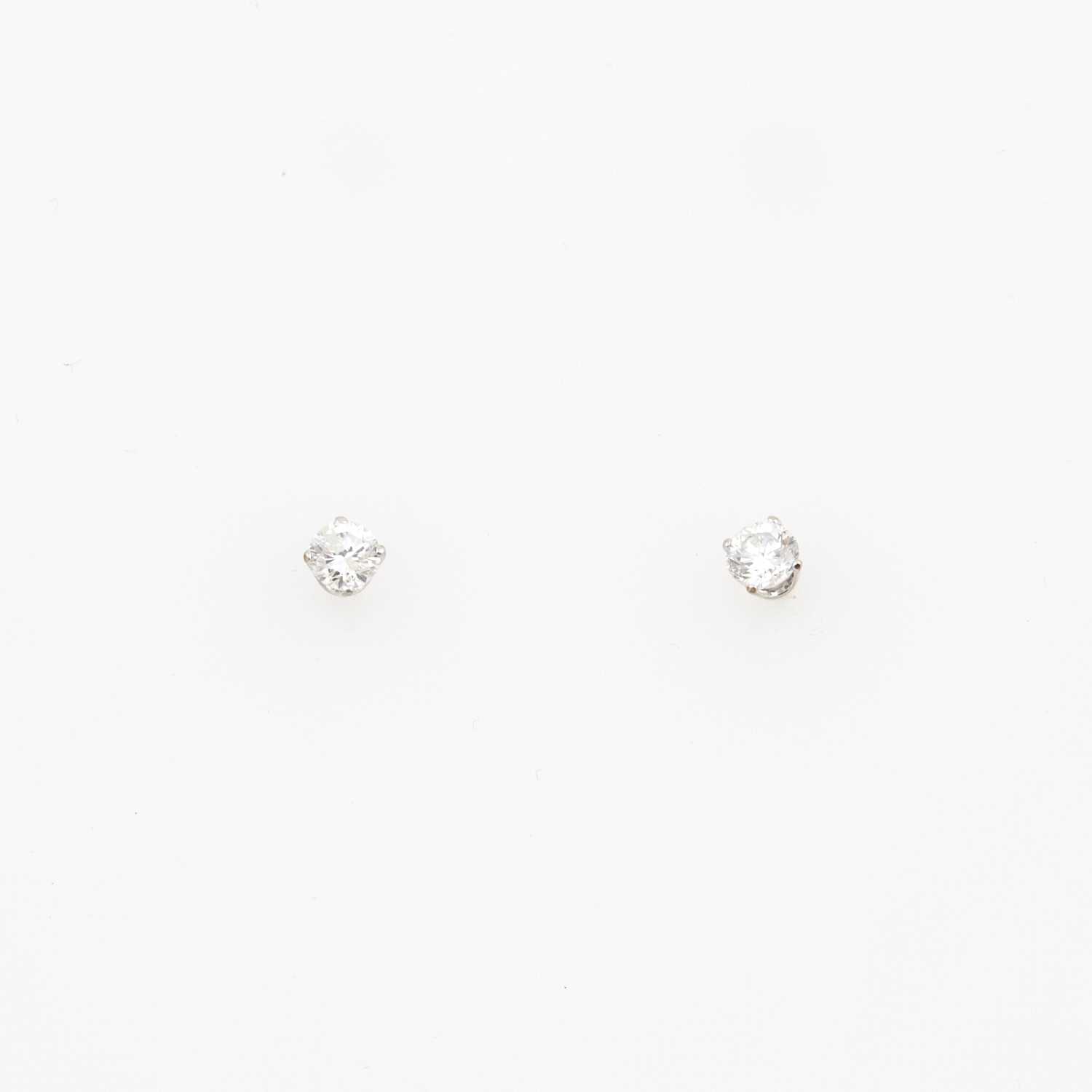 Lot 174 - Two Diamond Earrings about 0.50 ct., 14K