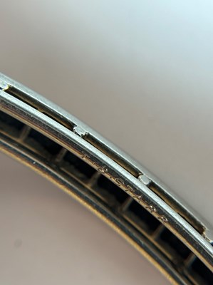 Lot 192 - Theodore B. Starr Platinum and Black Onyx Bangle Bracelet