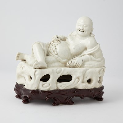 Lot 586 - A Chinese Dehua Porcelain Figure of Budai