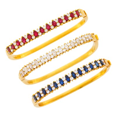 Lot 176 - Three Gold, Gem-Set and Diamond Bangle Bracelets