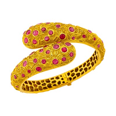 Lot 174 - Zolotas Gold and Ruby Crossover Bangle Bracelet