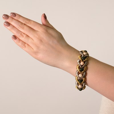 Lot 38 - Two-Color Gold, Angel Skin Coral and Nephrite Bracelet