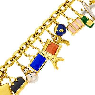 Lot 45 - Louis Vuitton Two-Color Gold, Hardstone and Enamel Travel Charm Bracelet, France
