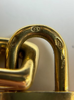 Lot 45 - Louis Vuitton Two-Color Gold, Hardstone and Enamel Travel Charm Bracelet, France